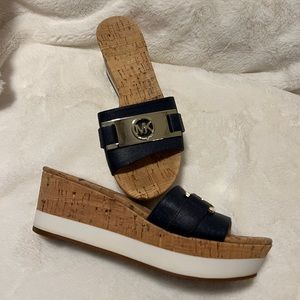 MK platform sandals in navy blue and creamy white. MK logo in great silver tones